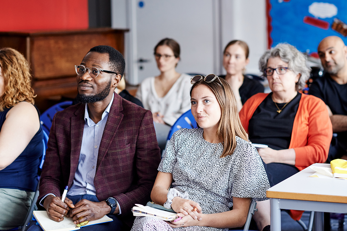 Teachers listening to a presentation